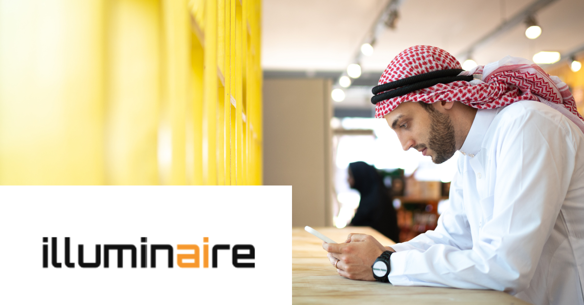 Man uses a tablet indoors, next to the "illuminaire" logo.