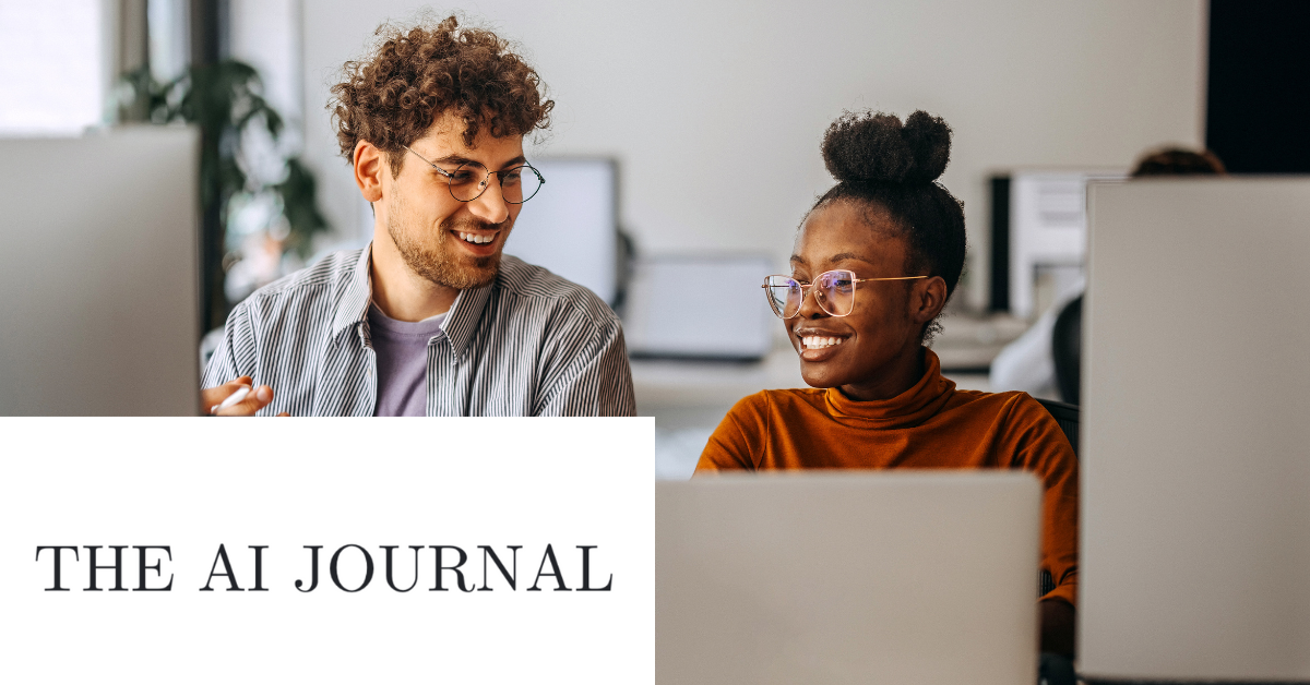 Two people smiling and talking in a class setting with "THE AI JOURNAL" text overlay.