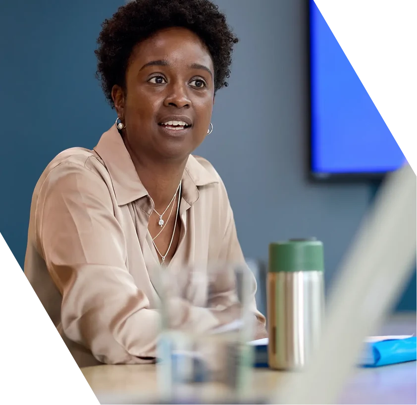Photo of a woman speaking in a meeting