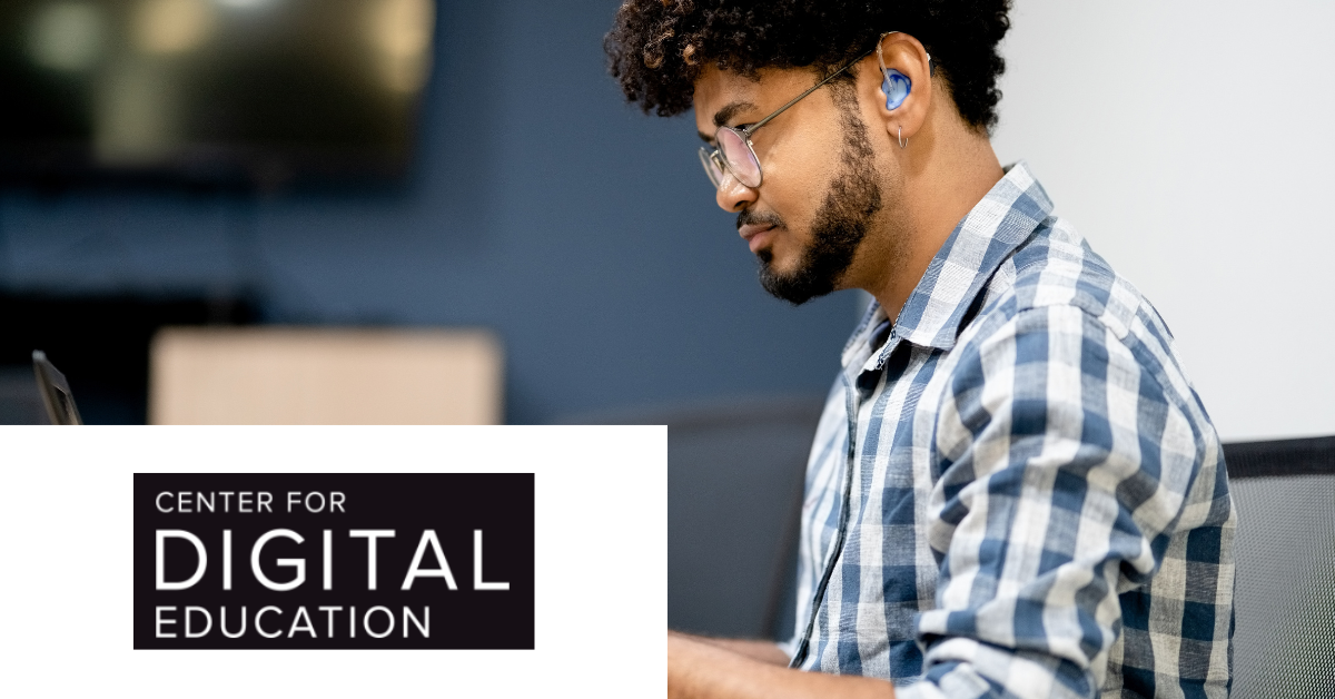 A university student with curly hair and wearing glasses and a hearing aid works on his laptop, in front of a blurred background. There is a logo with transcribed Text:  CENTER FOR DIGITAL EDUCATION