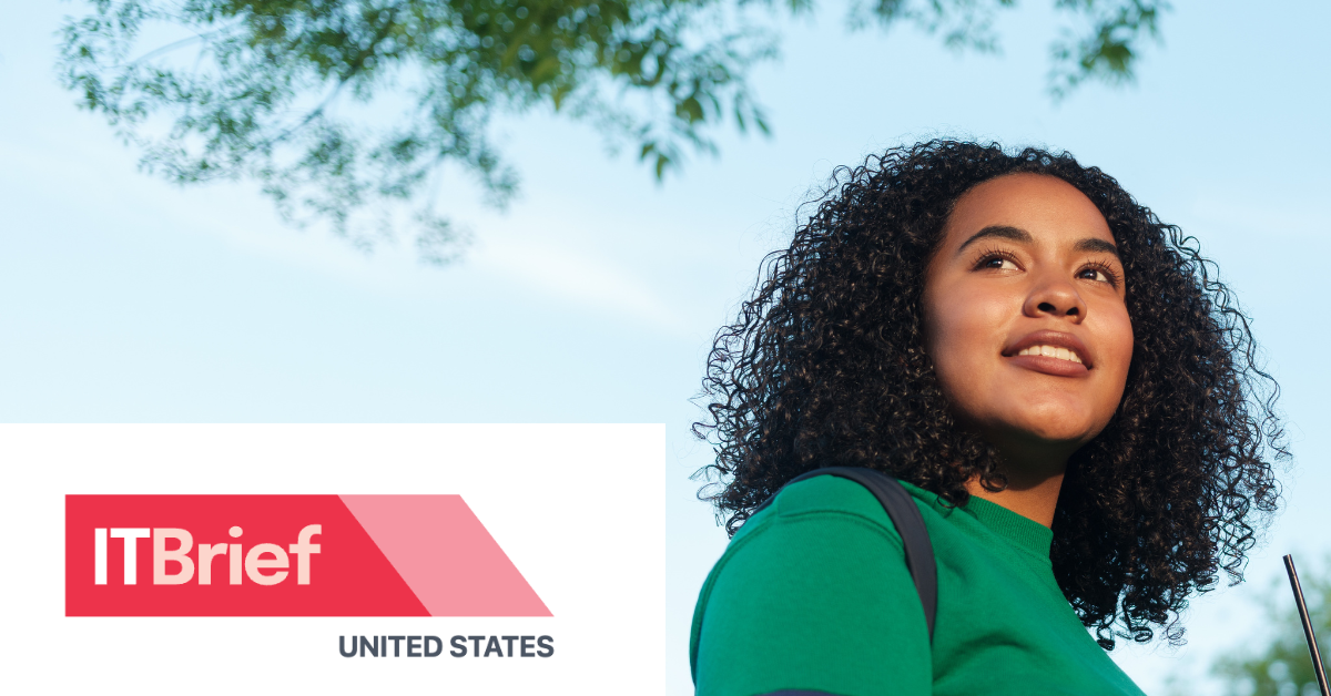 A university student smiles while walking outside.  Transcribed Text:  ITBrief UNITED STATES