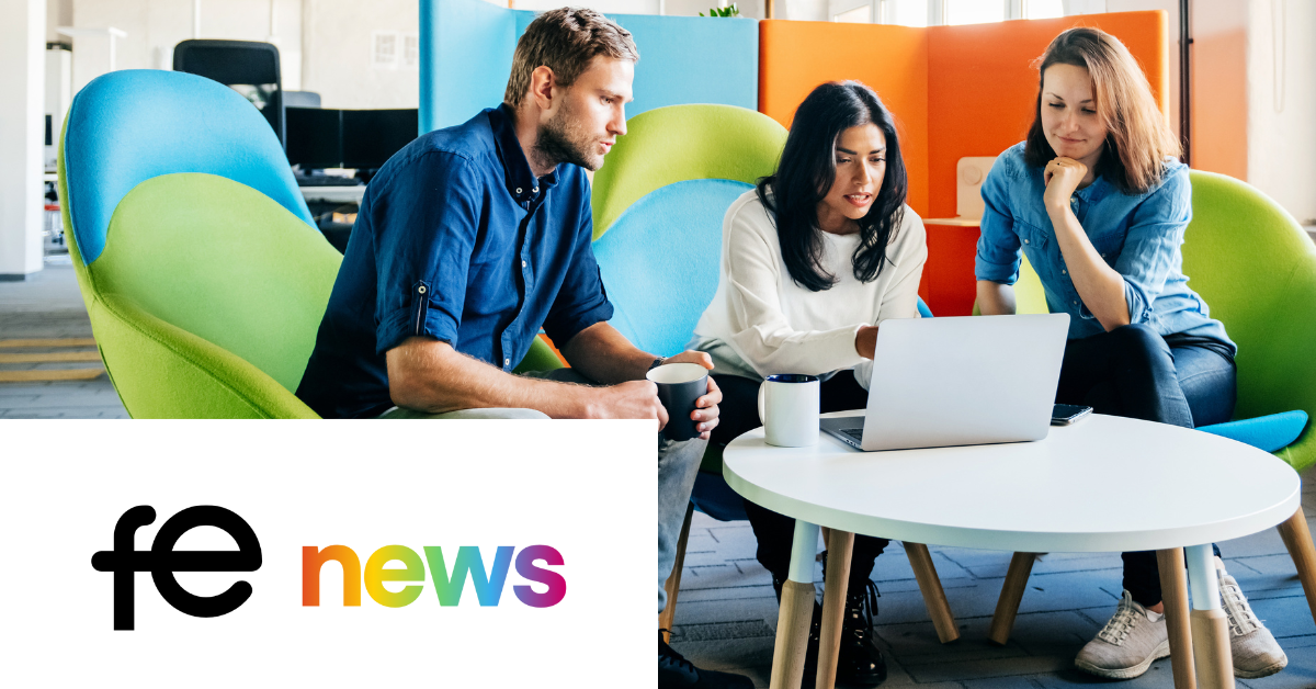 Three students working on a project together around a laptop with "fe news" logo. 