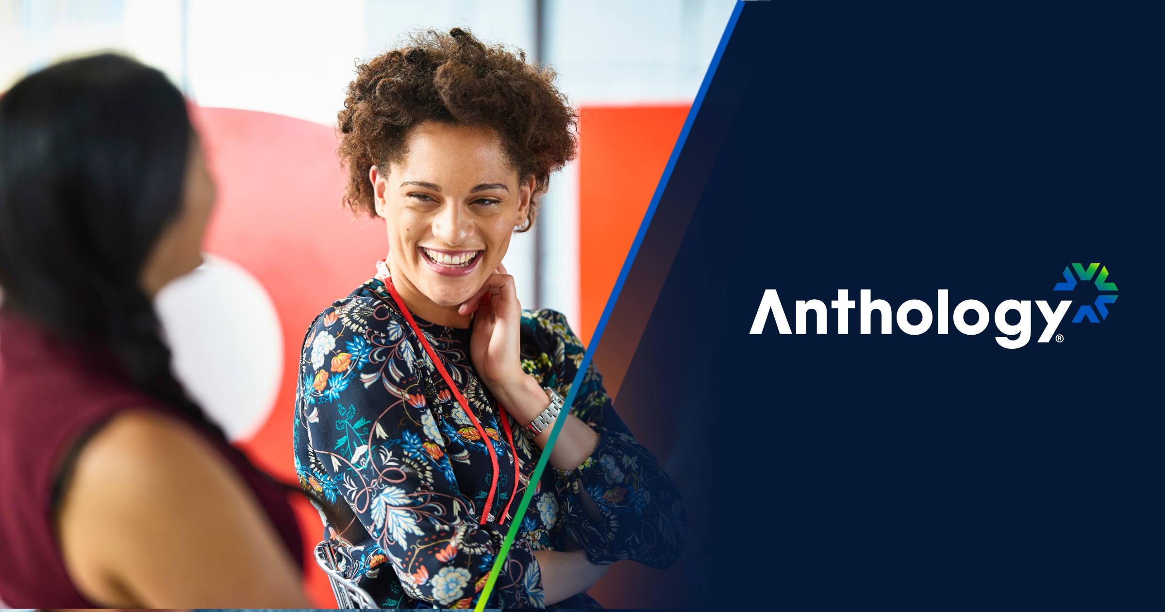 Two faculty members talking with "Anthology" logo on the right side.