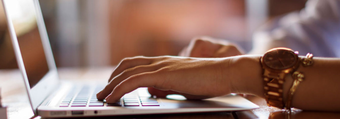 Woman typing a computer