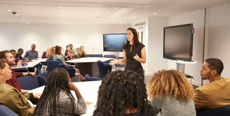 Photo of students and a teacher in a classroom