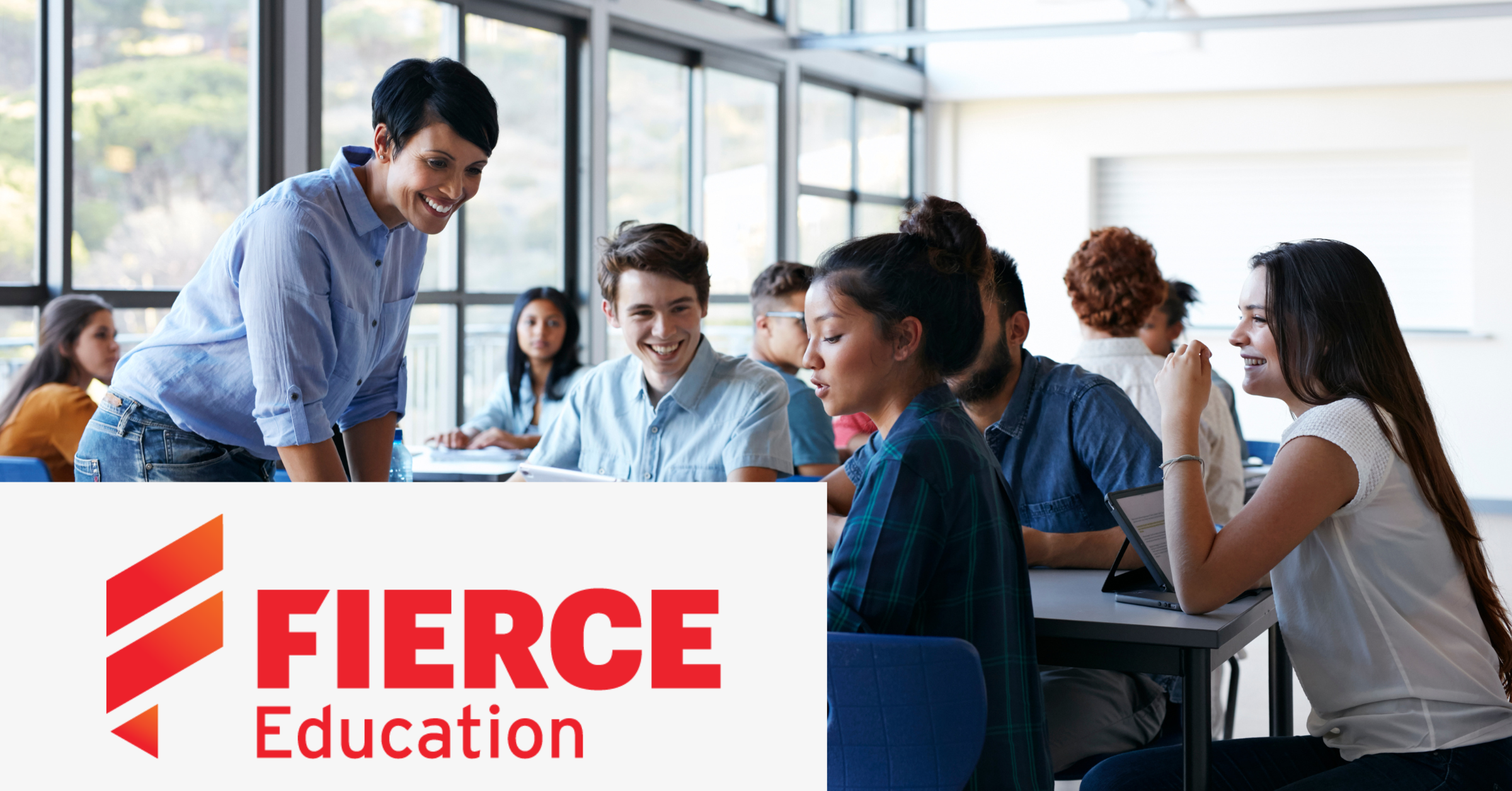 Image of a group of students interacting with a teacher with the Fierce Education logo placed on the left lower corner.
