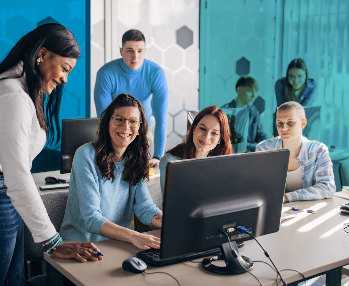Coworkers around a computer