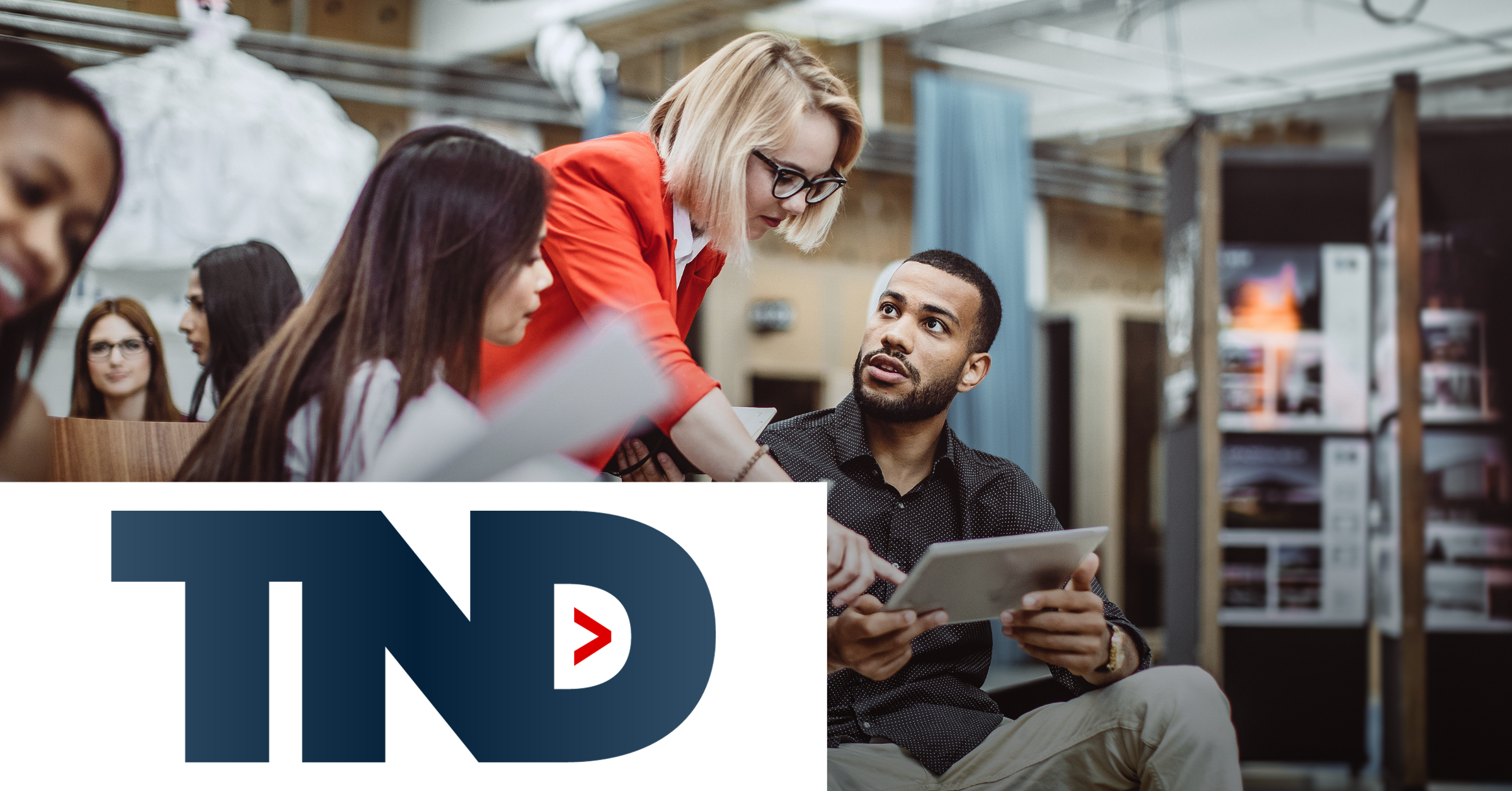 Image of a teacher giving some indications to two students. On the lower left corner of the graphic is placed the TND logo.