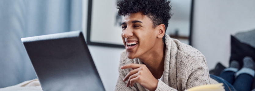 Photo of a person working at a laptop