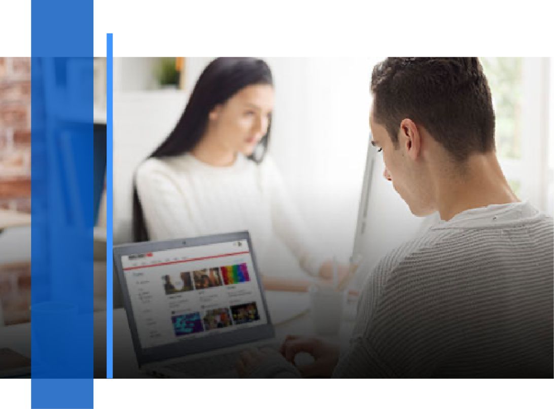 A man and woman working on their laptops