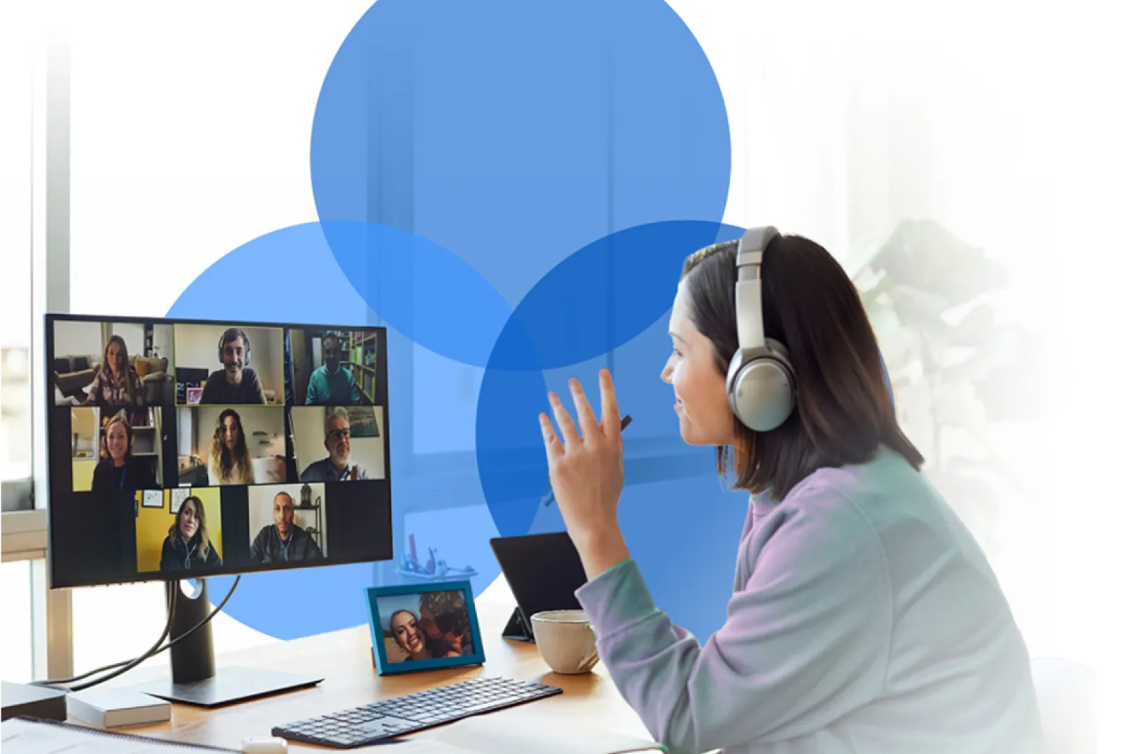 Photo of a woman on a conference call at her computer